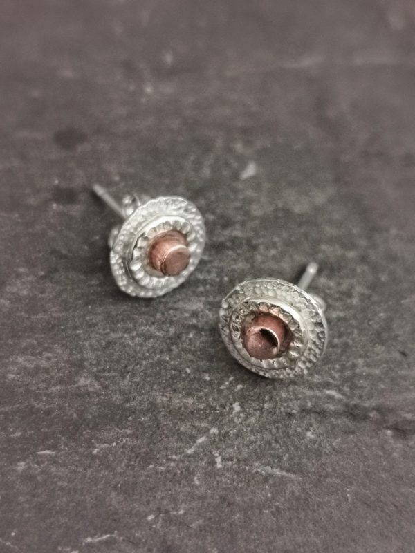 stud earring displayed on a slate surface - handmade sterling silver circle stud earrings