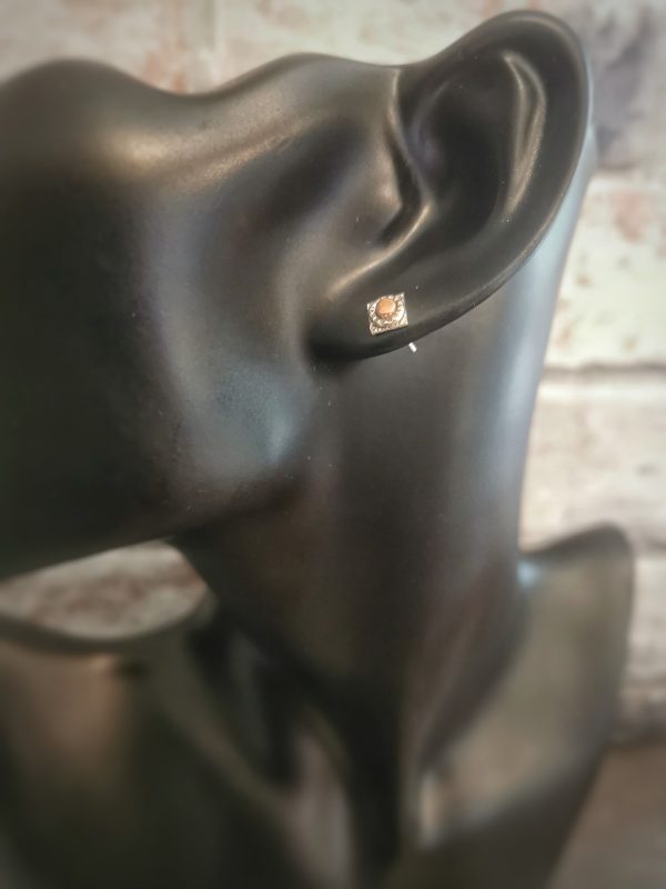 stud earring displayed on plastic model head - handmade sterling silver stud earrings