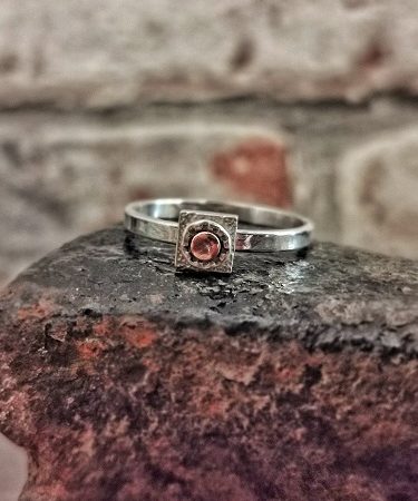ring displayed on a cobblers last - handmade sterling silver ring