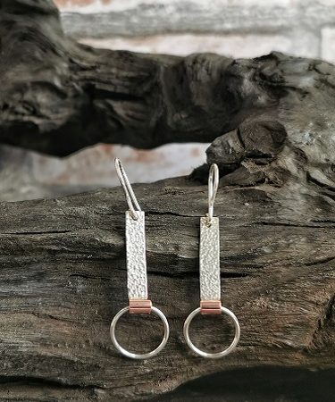 earrings displayed on bog oak - sterling silver hooped earrings