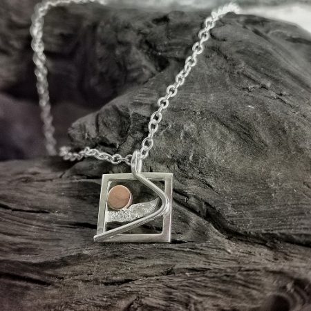 necklace displayed on bog oak - morrning sky handmade neckalce