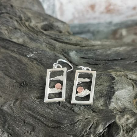 Earrings displayed on bog oak - morning sky sterling silver earrings