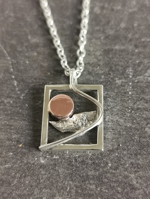 necklace on black slate - handmade sterling silver sunrise necklace