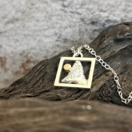 neckalce displayed on bog oak - morning sky sterling silver necklace