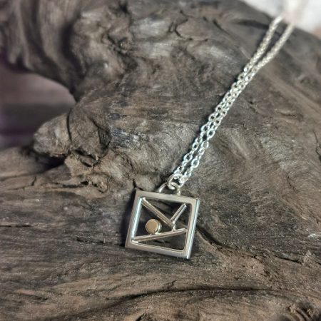 necklace displayed on bog oak - morning moon sterling silver necklace