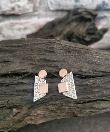 earrings displayed on bog oak - statement stud earrings