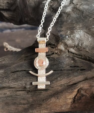necklace diplayed on bog oak - geometric handmade necklace