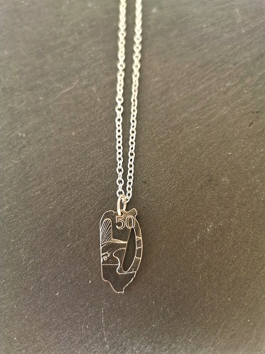 necklace displayed on black slate - 50p harp coin necklace