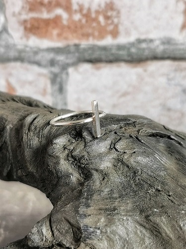 ring displayed on a cobblers last - minimal sterlng silver ring