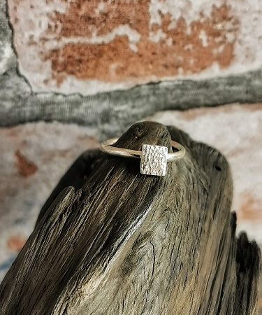 ring on bog oak - textured quare sterling silver ring