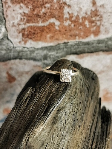 ring on bog oak - textured quare sterling silver ring