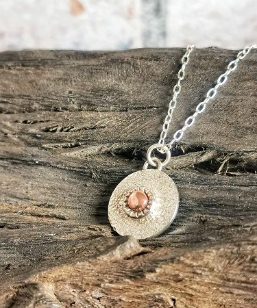 necklace on bog oak - concentric circle steling silver necklace