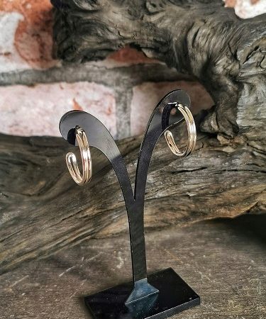 earring on display near bog oak - handmade sterling silver hoop earrings