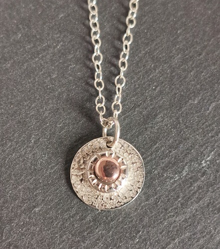 neckalce on black slate - sterling silver concentric circle necklace