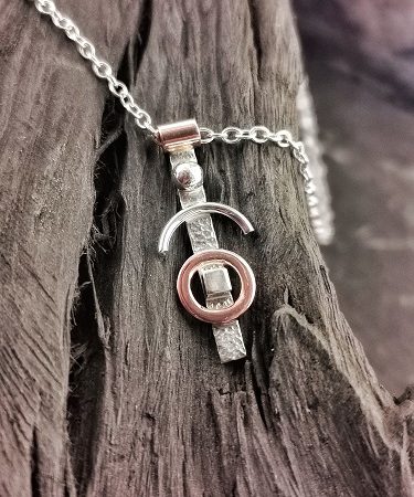 necklace displayed on bog oak - handmade textured geometric necklace