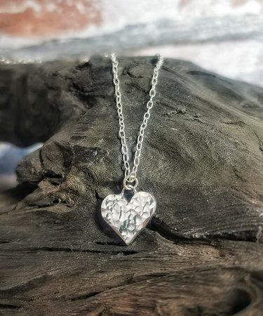 necklace displayed on bog oak - serling silver heart necklace